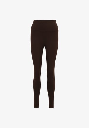 Braune Leggings aus dehnbarem Stoff, mit hohem Bund, figurbetontem Design und glatter Textur. Keine sichtbaren Muster oder Akzente.