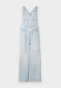 Salopette en denim bleu clair à jambes larges, avec bretelles ajustables, poche avant et détails en boutons sur les côtés. Matière en coton.