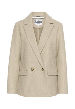 Blazer en mélange de laine beige présentant une fermeture croisée, des revers à cran, deux poches avant et une texture subtile. Étiqueté "Saint Tropez."