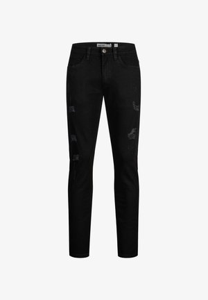 Zwarte slim-fit jeans met verweerde patches op de voorkant van de dijen en een knoopsluiting in de taille.