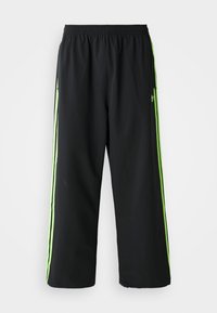 DRILL - Tracksuit bottoms - black/signal green