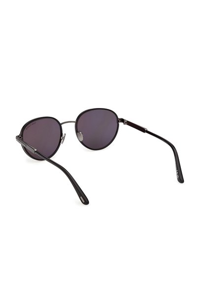 Lunettes de soleil rondes à monture métallique noire avec verres teintés foncés et fines branches noires, positionnées face vers le bas sur fond blanc.