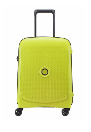 Yellow hard-shell suitcase with a textured surface, black zipper, retractable handle, and four wheels for mobility.