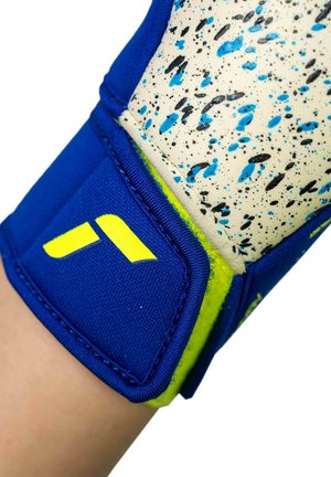 Close-up of a wrist wearing a blue and yellow protective glove with a speckled white and blue padded section.
