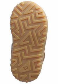 Semelle de chaussure en caoutchouc avec un motif en zigzag. Couleur beige clair avec une surface texturée et une section triangulaire étiquetée "20."