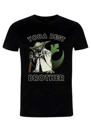T-shirt en coton noir avec un graphisme vert représentant un personnage avec des oreilles pointues et un bâton. Le texte "YODA MEILLEUR FRÈRE" est inscrit en dessous.