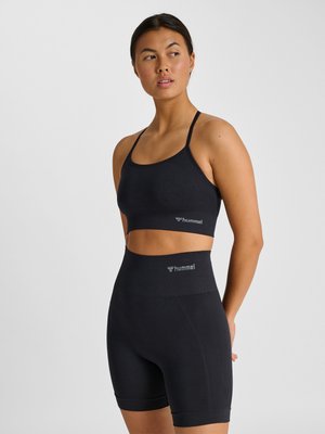 Hummel HMLTIFFY SEAMLESS - Brassières de sport à maintien léger - black