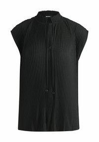 Top senza maniche plissettato nero con collo alto, caratterizzato da una chiusura con cravatta e una texture morbida, creando una forma strutturata ma fluida.