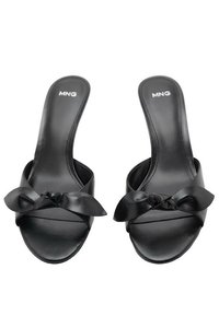 Black slide sandals with a smooth synthetic upper, featuring a bow accent and open toe design. Flat sole with minimal pattern.