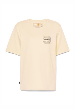 Kortærmet, cremefarvet T-shirt lavet af bomuld, med et sort Timberland-logo printet på brystet og et side-tag.