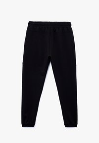 Sorte sweatpants med elastisk talje, tilspidsede ben og elastiske mancher. Fremstillet af blød stof med en glat tekstur. To sidelommer.