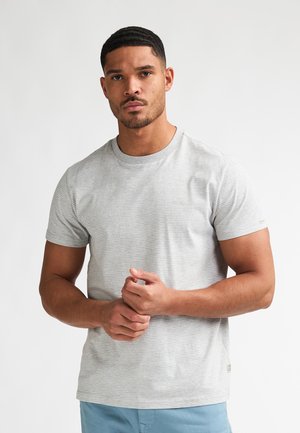 Graues gestreiftes T-Shirt aus Baumwolle, mit rundem Ausschnitt und kurzen Ärmeln. Auffällige Nahtdetails nahe dem Saum.