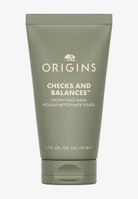 Groene knijptubeverpakking met een beige label. Tekst bevat "Origins" en "Checks and Balances Frothy Face Wash." Inhoud 50 ml.