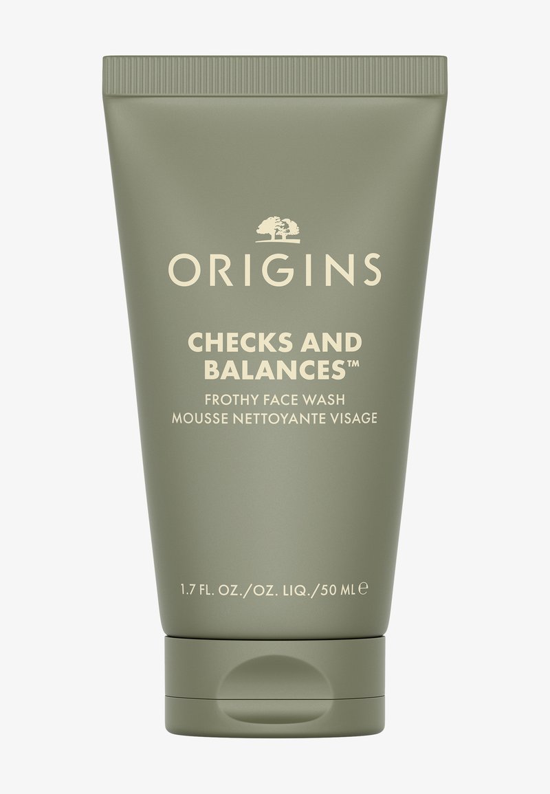 Groene knijptubeverpakking met een beige label. Tekst bevat "Origins" en "Checks and Balances Frothy Face Wash." Inhoud 50 ml.