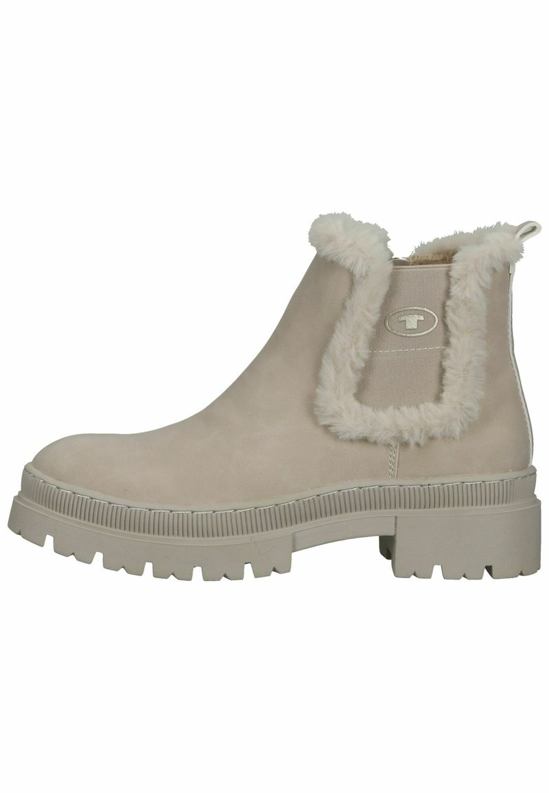 Bottine beige avec bord en fausse fourrure, panneau latéral élastique, semelle en caoutchouc et semelle texturée. Matériau lisse avec un léger éclat.