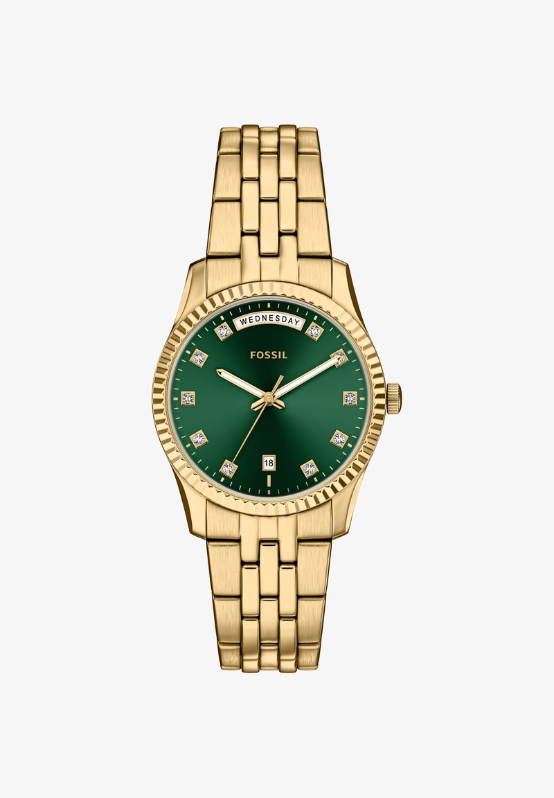 Gyldent ur med grøn urskive, diamantinspirerede markører og dag-/dato-display. Har et sammenkoblet metalarmbånd og tekstureret krans.