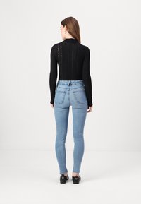 Good American BABY STEP HEM - Jeans Skinny Fit - indigo