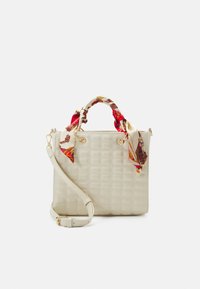 Cream-colored handbag with a textured surface, featuring a decorative scarf tied around the handles and a detachable shoulder strap.