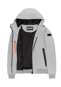 Γκρι φούτερ με κουκούλα και μαύρη επένδυση, διαθέτει πορτοκαλί φερμουάρ, μαύρες λεπτομέρειες και ελαστικούς καρπούς. Κατασκευασμένο από αδιάβροχο υλικό.