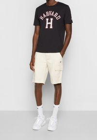 Champion Rochester Triko s potiskem - black