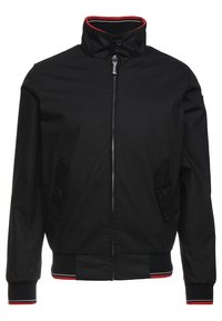 Svart zip-up jacka med hög krage, knappade ficklock, ribbade manschetter och nederkant med detaljer i röd och vit.