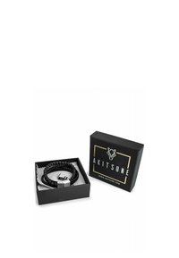 Black beaded bracelet featuring a cylindrical metallic clasp, presented in a sleek black box with gold accents and brand logo.