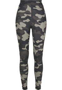Camouflage leggings featuring a blend of dark green, gray, and black colors. Made of stretchy fabric with a high waist design.