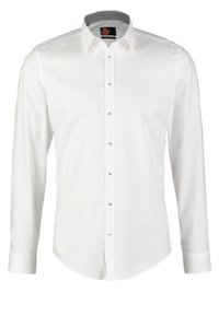 Camicia bianca a maniche lunghe con vestibilità slim, dotata di chiusura con bottoni frontale, colletto discreto e dettagli con bottoni argento. Texture liscia e intrecciata.