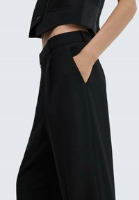 Mango MAURA - Hlače - black