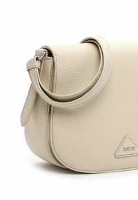 Small beige leather shoulder bag with adjustable strap and "RUE 09" embossed on the lower right corner.