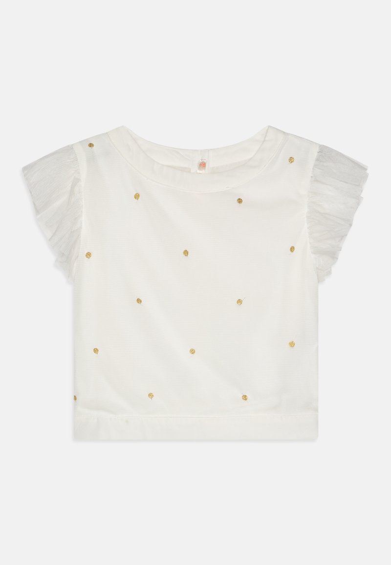 Haut blanc à manches courtes pour filles avec manches en tulle volantées et petits points de paillettes dorées dispersés sur le devant.