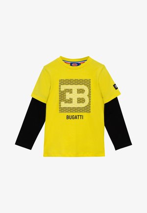 Gul kortærmet skjorte med sorte lange ærmer under, med et pixeleret tekstdesign og ordet "BUGATTI" foran.