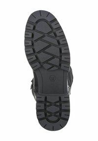 Semelle de botte en caoutchouc noir avec une surface texturée et un motif de relief profond, affichant la taille marquée '37' et un détail de fermeture éclair sur le côté.