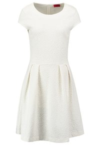 Kurzes ärmelloses weißes Kleid mit strukturiertem Design, rundem Ausschnitt, tailliertem Oberteil und ausgestellt, plissiertem Rock. Reißverschluss auf der Rückseite.