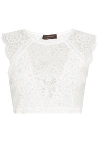 Vit spetscroptop med blommönster och vågiga korta ärmar, med rund halsringning och en liten varumärkesetikett inuti kragen.