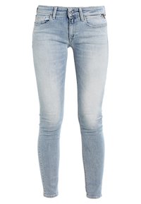 Jasnoniebieskie skinny jeans z przetarciami, z przodem zapinanym na guzik i zamek błyskawiczny, z szlufkami na pasek oraz pięciokomorowym designem.