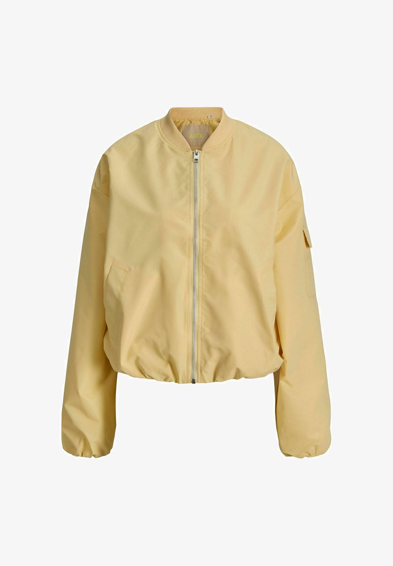 Ανοιχτό κίτρινο κοντό μπουφάν με φερμουάρ μπροστά, ραμμένο λαιμό και μανίκια, πλαϊνές τσέπες και τσέπη στο αριστερό μανίκι.