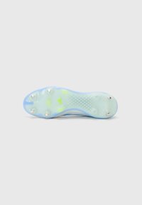 Light blue football cleat sole with translucent material, eight metallic studs, textured grip patterns, and a subtle yellow accent.
