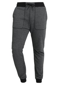 Grå sweatpants med dragsko i midjan, med två framfickor och svarta ribbade muddar. Mjuk tyg med melerat mönster.