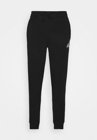 Schwarze Jogginghosen aus weichem Stoff, mit einem elastischen Bund und Kordelzug, tapered Beinen und einem kleinen Logo auf der linken Seite.