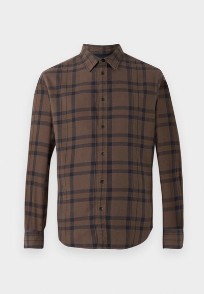 Camicia a maniche lunghe a quadri marroni con chiusura a bottoni, dotata di colletto e bottoni neri. Realizzata in un morbido tessuto di cotone.