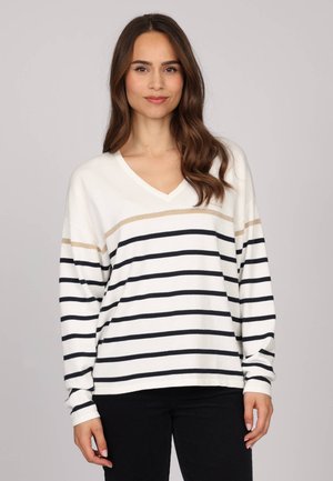 T-shirt à manches longues et col en V blanc avec des rayures horizontales noires et beiges, en tissu léger, coupe décontractée et manches à poignets.