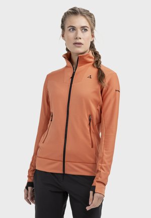 Orangefarbene Jacke zum Reißverschluss mit hohem Kragen, versehen mit seitlichen Reißverschlusstaschen und schwarzen Akzenten. Hergestellt aus strukturiertem, weichem Stoff mit tailliertem Schnitt.