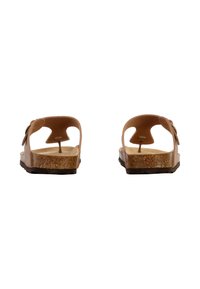 Sandales marron avec une semelle en liège texturée, design à dos ouvert et entre-doigts. Sangle réglable avec une finition lisse. Semelle extérieure en caoutchouc durable.