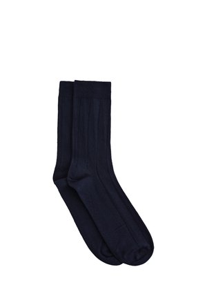 Chaussettes en coton bleu marine avec texture côtelée verticale, présentant un design uni et un bord renforcé pour une meilleure durabilité.