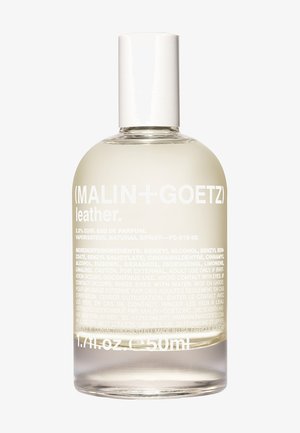 Bottiglia di vetro rotonda del profumo Leather di (MALIN + GOETZ). Liquido trasparente, tappo bianco, etichetta con testo bianco prominente che riporta i dettagli del prodotto.