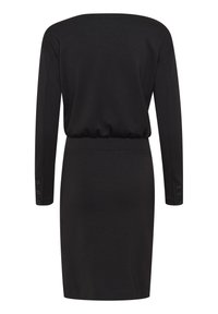 Robe noire cintrée à manches longues avec des détails de boutons aux poignets et un léger froncé à la taille, vue de dos.