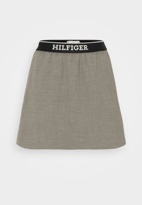 Schwarz-weiß karierten Rock mit einem anliegenden Bund, der das „HILFIGER“ Logo trägt. A-Linien-Schnitt mit glattem Material, knielang.