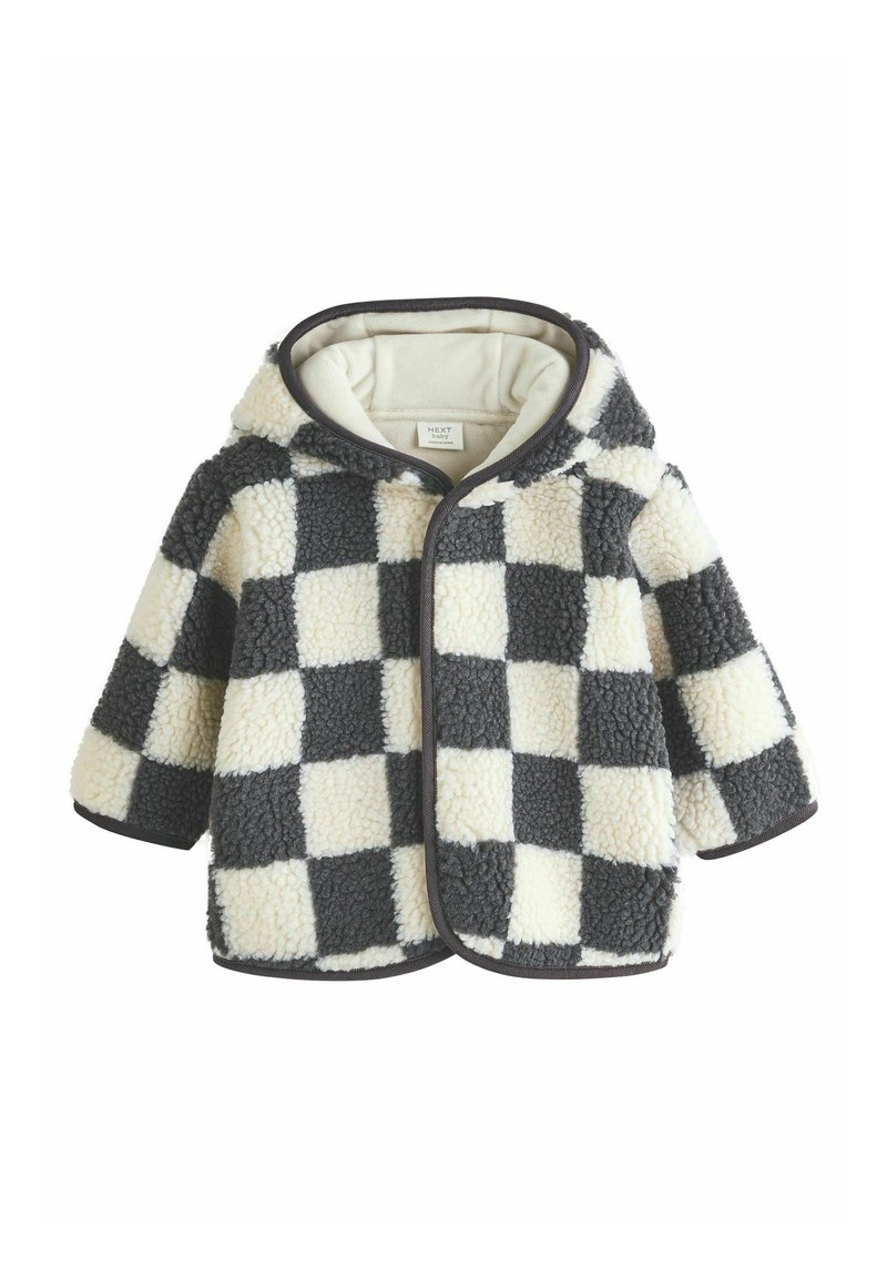 Fleece takki, jossa on huppu ja musta-valkoinen ruutukuvio. Ominaisuuksiin kuuluu pehmeä pinta, pyöristetyt reunat ja erottuva tumma päällyste aukkojen ympärillä.
