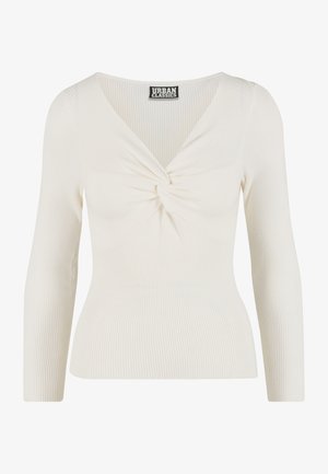 Dlouhý rukáv, top s výstřihem do V z lehké smetanově bílé žebrované látky se zauzleným detailem na hrudi. Měkká textura a přiléhavý střih.